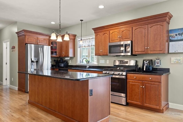 1 Windsor Rd, Shirley, MA 01464 - kitchen with stainless steel appliances, a kitchen island, light wood-type flooring, hanging light fixtures, and recessed lighting