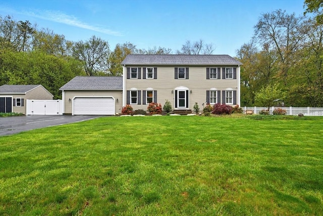 3 Pine Knl, Southwick, MA 01077 - colonial house featuring an attached garage, driveway, and a gate