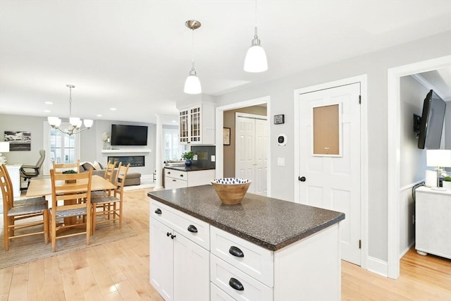 3 Pine Knl, Southwick, MA 01077 - kitchen with dark countertops, light wood finished floors, open floor plan, a kitchen island, and recessed lighting