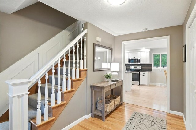 3 Pine Knl, Southwick, MA 01077 - staircase featuring wood finished floors and baseboards