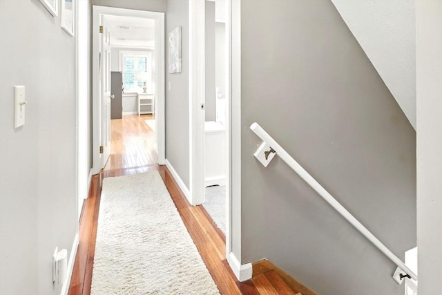 3 Pine Knl, Southwick, MA 01077 - hallway featuring an upstairs landing, light wood-type flooring, and baseboards