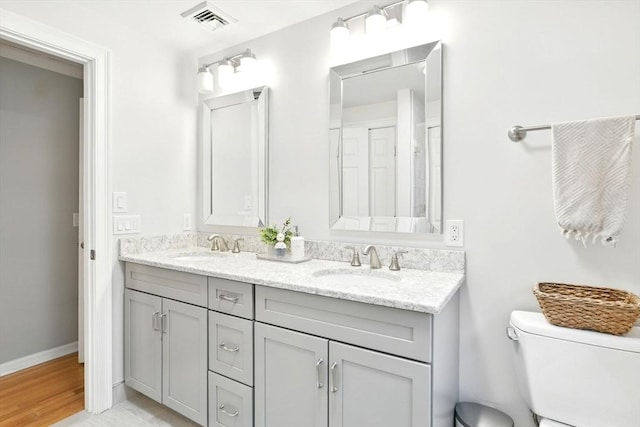 3 Pine Knl, Southwick, MA 01077 - full bathroom with toilet, double vanity, and baseboards