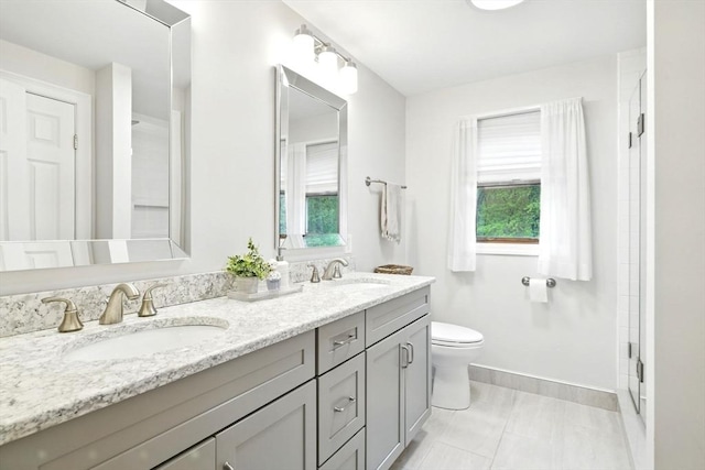 3 Pine Knl, Southwick, MA 01077 - full bathroom with double vanity, toilet, baseboards, and a shower