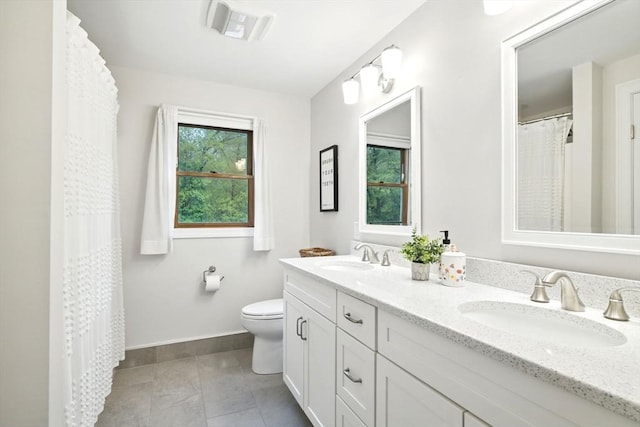 3 Pine Knl, Southwick, MA 01077 - full bathroom featuring toilet, baseboards, double vanity, and tile patterned floors