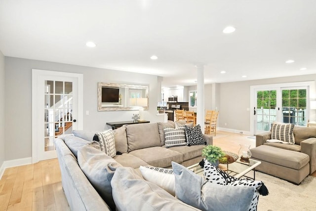 3 Pine Knl, Southwick, MA 01077 - living room with baseboards, light wood-type flooring, stairway, recessed lighting, and ornate columns