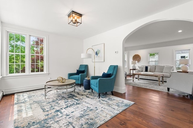 6 Parker Ave, Cohasset, MA 02025 - sitting room with arched walkways, plenty of natural light, wood finished floors, baseboard heating, and recessed lighting