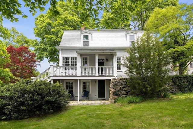 6 Parker Ave, Cohasset, MA 02025 - rear view of property featuring a yard, a deck, a chimney, and stairs