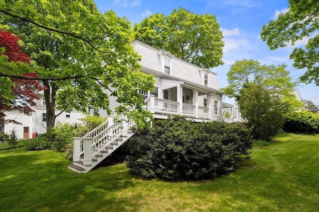 6 Parker Ave, Cohasset, MA 02025 - back of property with a yard and stairs
