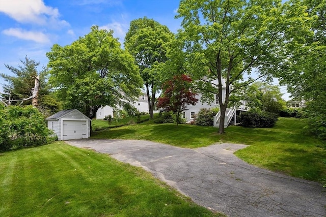 6 Parker Ave, Cohasset, MA 02025 - view of green lawn with an outbuilding, a garage, stairway, and driveway