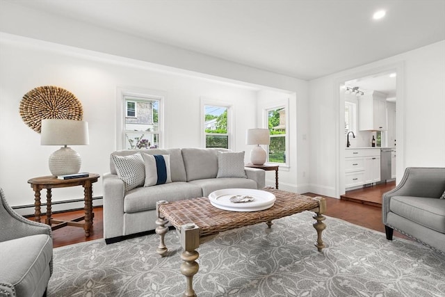 6 Parker Ave, Cohasset, MA 02025 - living area featuring a baseboard heating unit, wood finished floors, recessed lighting, and baseboards