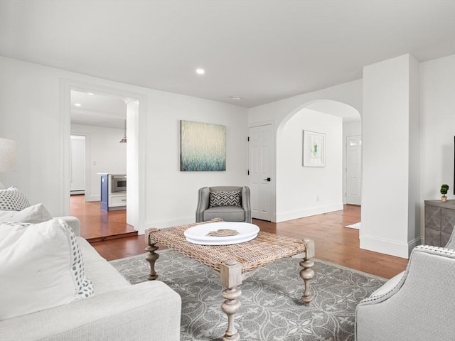 6 Parker Ave, Cohasset, MA 02025 - living area with wood finished floors, arched walkways, baseboards, and recessed lighting