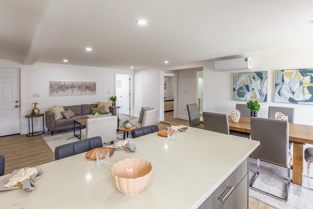 247 Pitman St, Fall River, MA 02723 - kitchen with a wall mounted air conditioner, light wood finished floors, recessed lighting, open floor plan, and beam ceiling