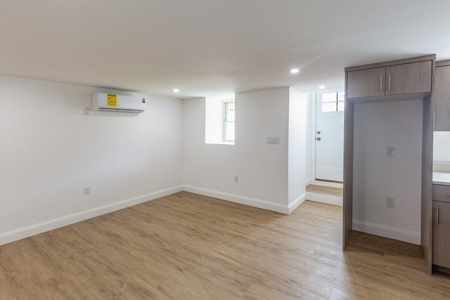247 Pitman St, Fall River, MA 02723 - below grade area with a wall mounted air conditioner, light wood-type flooring, baseboards, and recessed lighting