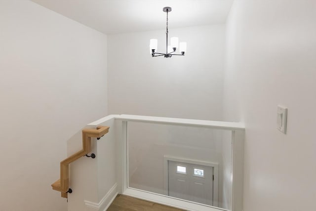 247 Pitman St, Fall River, MA 02723 - stairway with a chandelier, baseboards, and wood finished floors