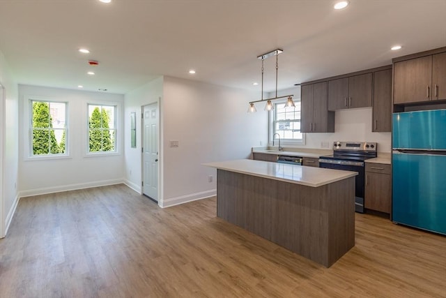 247 Pitman St, Fall River, MA 02723 - kitchen with fridge, electric range, a sink, dishwasher, and light countertops