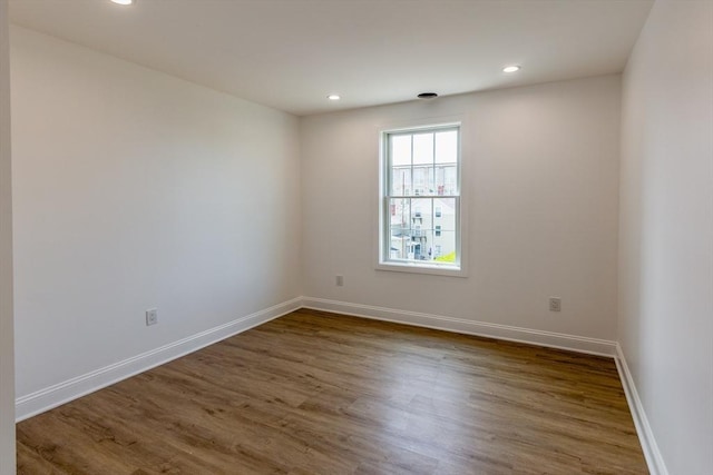 247 Pitman St, Fall River, MA 02723 - empty room featuring baseboards, recessed lighting, and wood finished floors