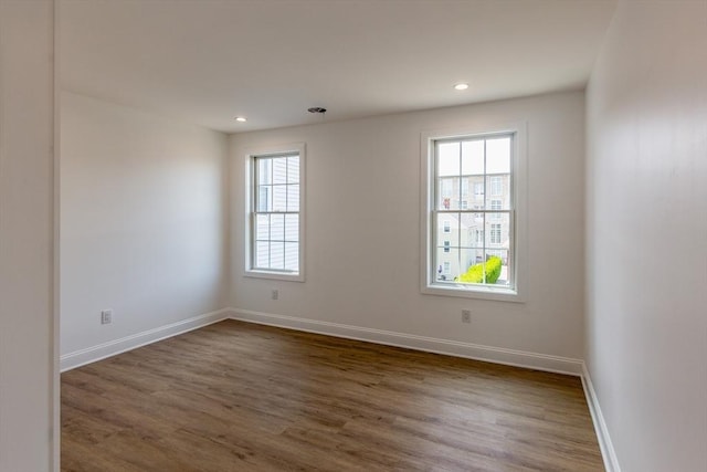 247 Pitman St, Fall River, MA 02723 - empty room featuring plenty of natural light, dark wood-style flooring, recessed lighting, and baseboards
