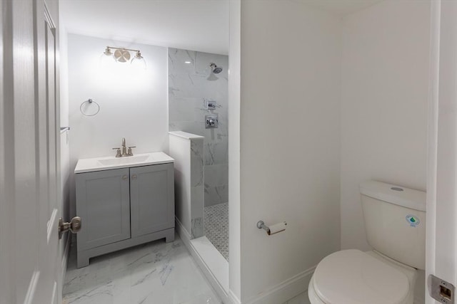 247 Pitman St, Fall River, MA 02723 - bathroom with marble finish floors, a tile shower, toilet, and vanity