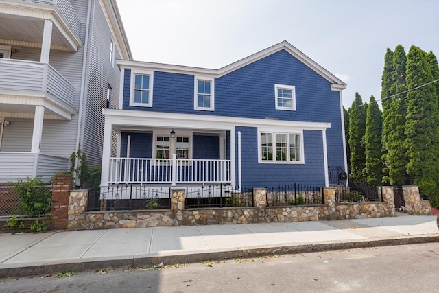 247 Pitman St, Fall River, MA 02723 - view of front facade featuring covered porch and a fenced front yard