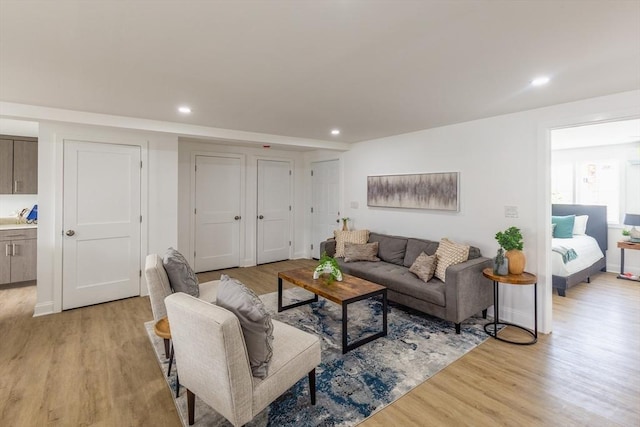 247 Pitman St, Fall River, MA 02723 - living area with light wood-style flooring, recessed lighting, and baseboards