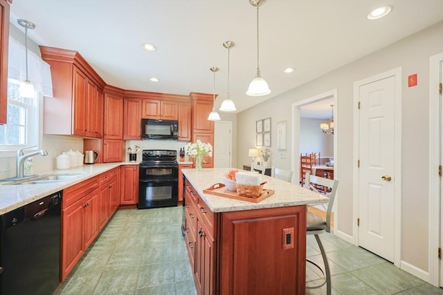 kitchen with light stone countertops, a sink, black appliances, a breakfast bar, and recessed lighting