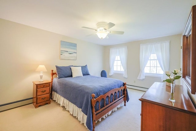 bedroom with a ceiling fan, a baseboard heating unit, and light carpet