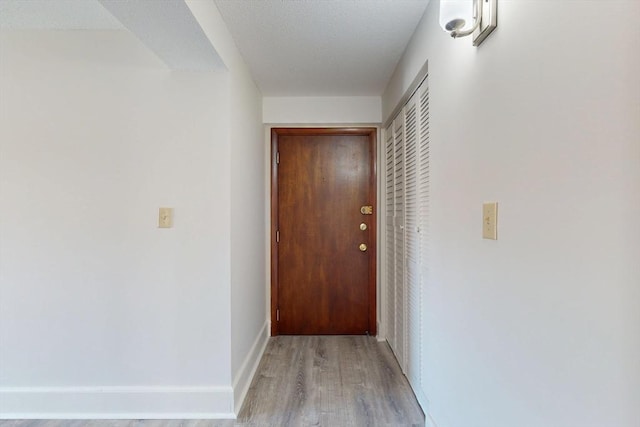47 Mystic St Unit 4E, Arlington, MA 02474 - hall with light wood-style flooring and baseboards