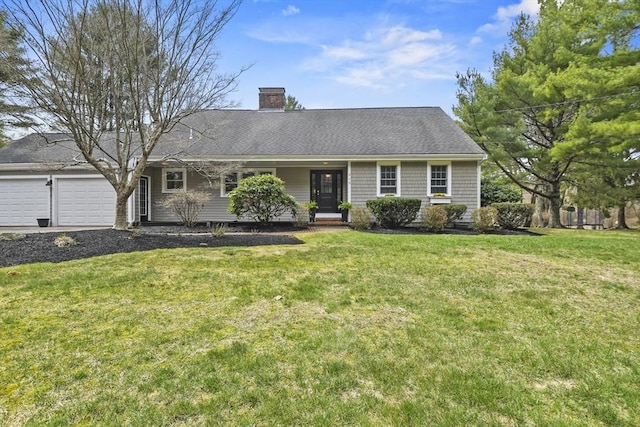 ranch-style home featuring a chimney, a front lawn, driveway, and a garage