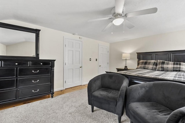 bedroom with baseboards, wood finished floors, and ceiling fan