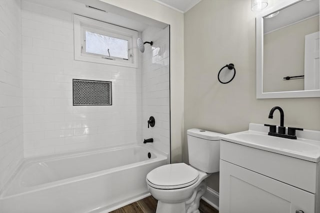 full bathroom featuring wood-type flooring, vanity, toilet, and tiled shower / bath