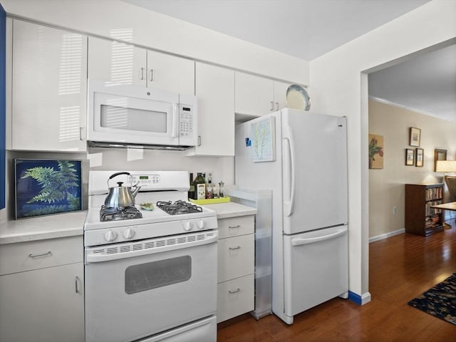 kitchen featuring white appliances, baseboards, dark wood finished floors, light countertops, and white cabinets