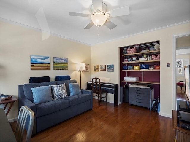 living room with dark wood finished floors, baseboards, ceiling fan, and ornamental molding