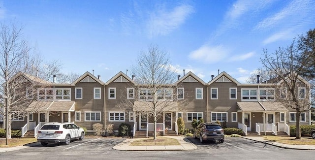 view of property featuring uncovered parking