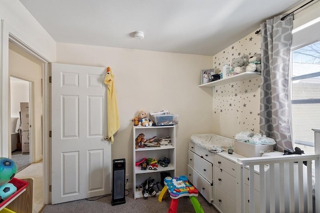 recreation room with carpet flooring