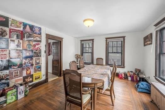 90 Rochelle St, Springfield, MA 01109 - dining area featuring radiator and wood finished floors