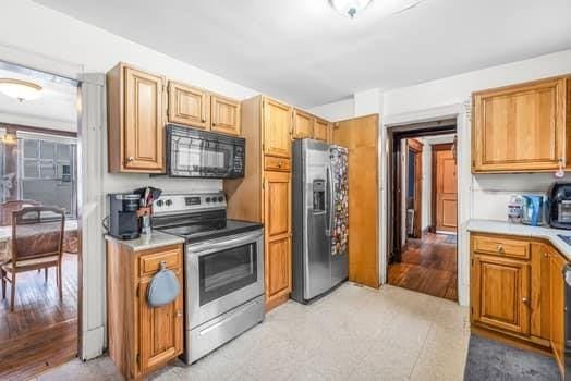 90 Rochelle St, Springfield, MA 01109 - kitchen with stainless steel appliances and light countertops