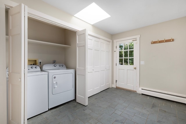 laundry area with a baseboard radiator and independent washer and dryer