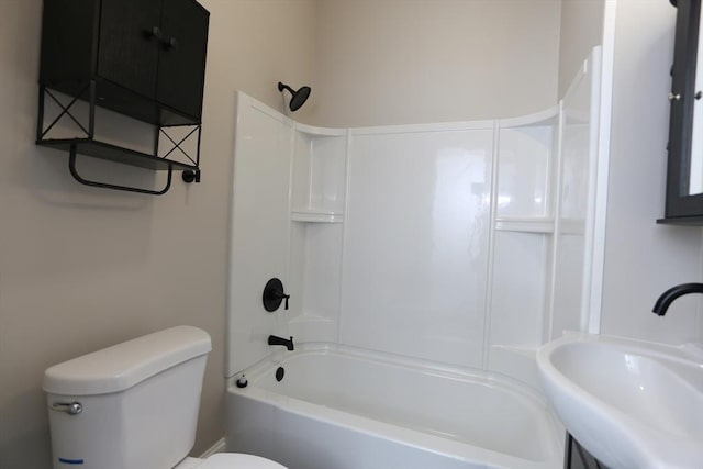 full bathroom featuring sink, washtub / shower combination, and toilet