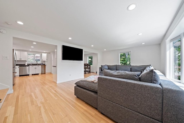 7 Helen Rd, Braintree, MA 02184 - living area featuring healthy amount of natural light, recessed lighting, and light wood-style floors