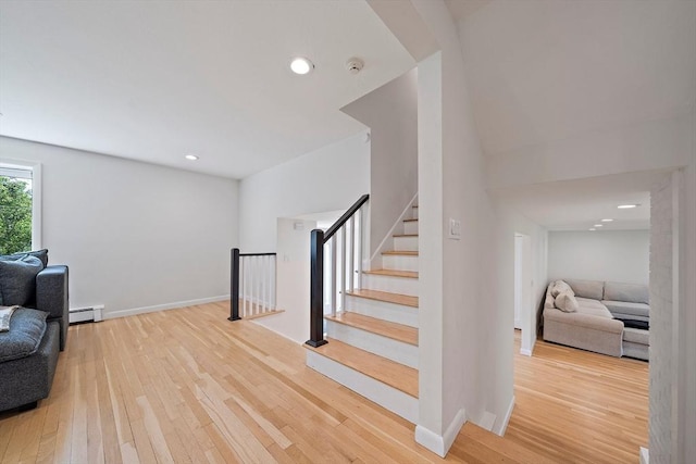 7 Helen Rd, Braintree, MA 02184 - living area featuring baseboard heating, wood finished floors, recessed lighting, and stairs