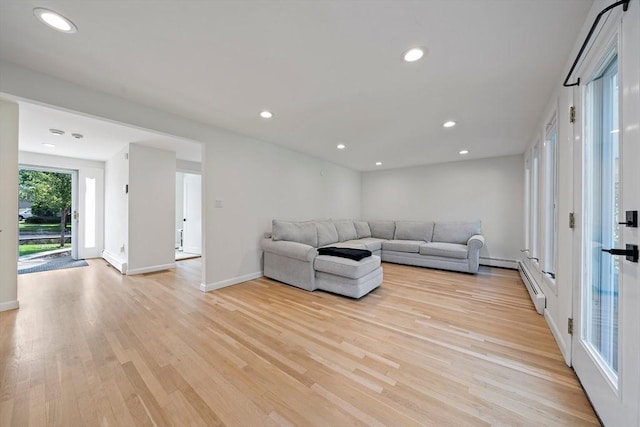7 Helen Rd, Braintree, MA 02184 - living area with light wood-style flooring, recessed lighting, and baseboard heating