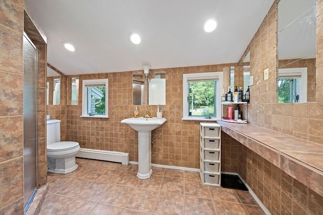 7 Helen Rd, Braintree, MA 02184 - bathroom featuring a baseboard radiator, tile walls, tile patterned floors, and recessed lighting