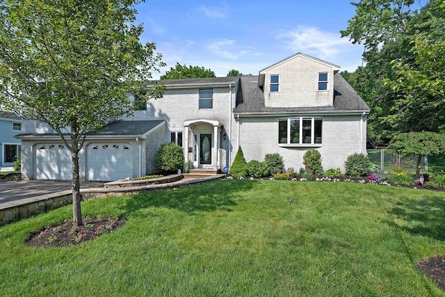 7 Helen Rd, Braintree, MA 02184 - view of front of home featuring brick siding, an attached garage, and driveway