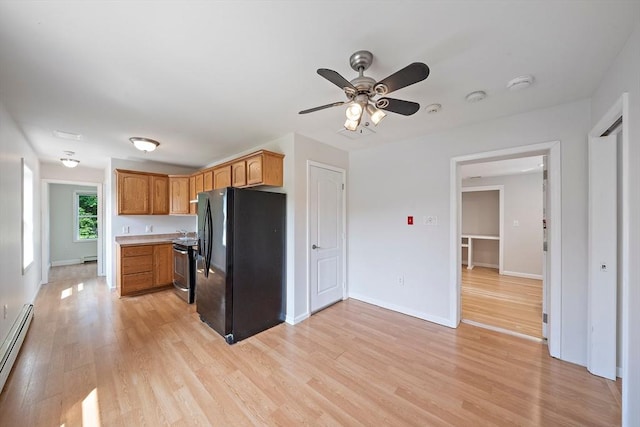 7 Helen Rd, Braintree, MA 02184 - kitchen featuring freestanding refrigerator, light wood finished floors, baseboard heating, ceiling fan, and light countertops