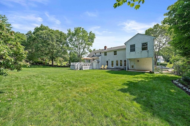 7 Helen Rd, Braintree, MA 02184 - view of green lawn featuring a deck