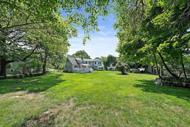 7 Helen Rd, Braintree, MA 02184 - view of grassy yard featuring a wooden deck