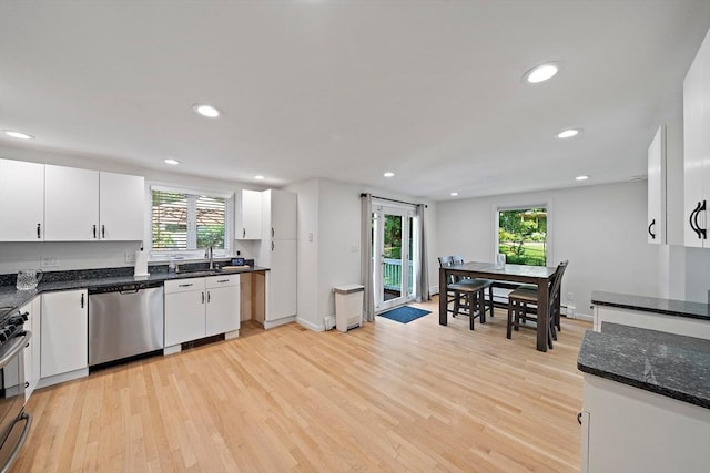 7 Helen Rd, Braintree, MA 02184 - kitchen with stainless steel appliances, light wood-style floors, white cabinets, recessed lighting, and dark stone countertops