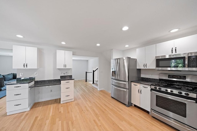 7 Helen Rd, Braintree, MA 02184 - kitchen featuring stainless steel appliances, light wood-style flooring, white cabinets, and recessed lighting