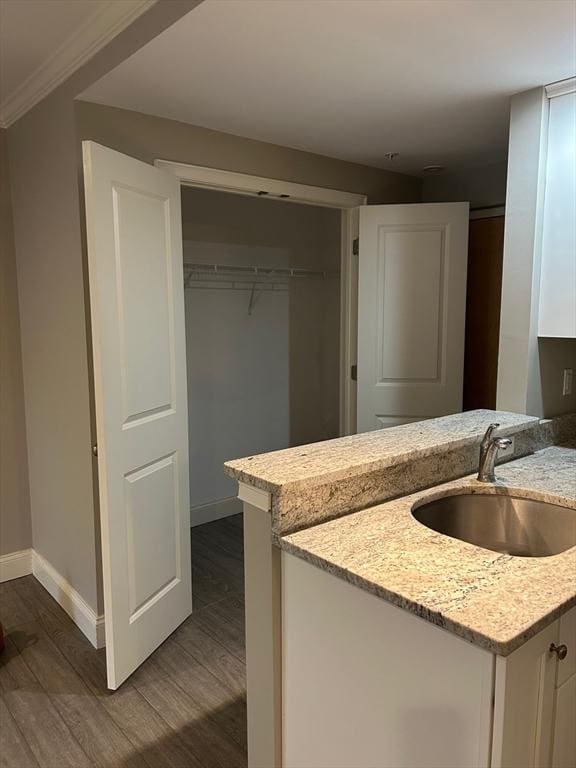 interior space with hardwood / wood-style flooring and vanity