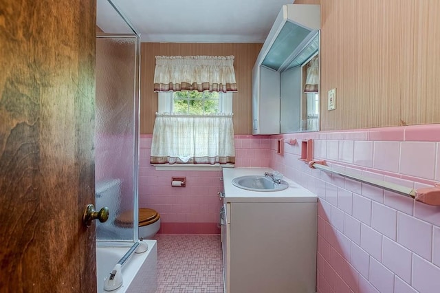 16 Miriam Dr, Attleboro, MA 02703 - full bath featuring tile walls, vanity, toilet, and bath / shower combo with glass door